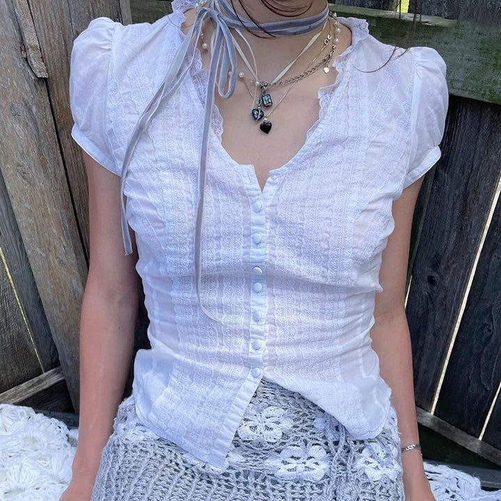 Dame Elegant bluseoberst med ruffle detaljer og knaplukning Skovae