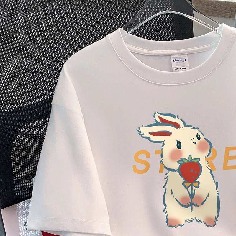 Dame T-shirt med glad tegneserie-kaninmotiv og kreativ tekst Stilla