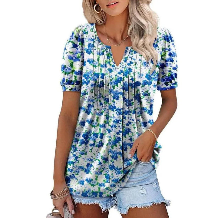 Damebluse med flæseærmer og blomsterdesign Stilla