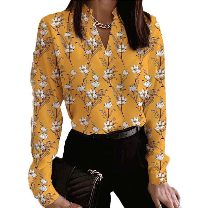 Damebluse med blomstret print og elegant krave Stilla