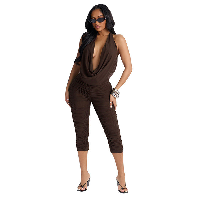 Damer elegant og figursyet jumpsuit med dyb V-udskæring og draperinger Skovae
