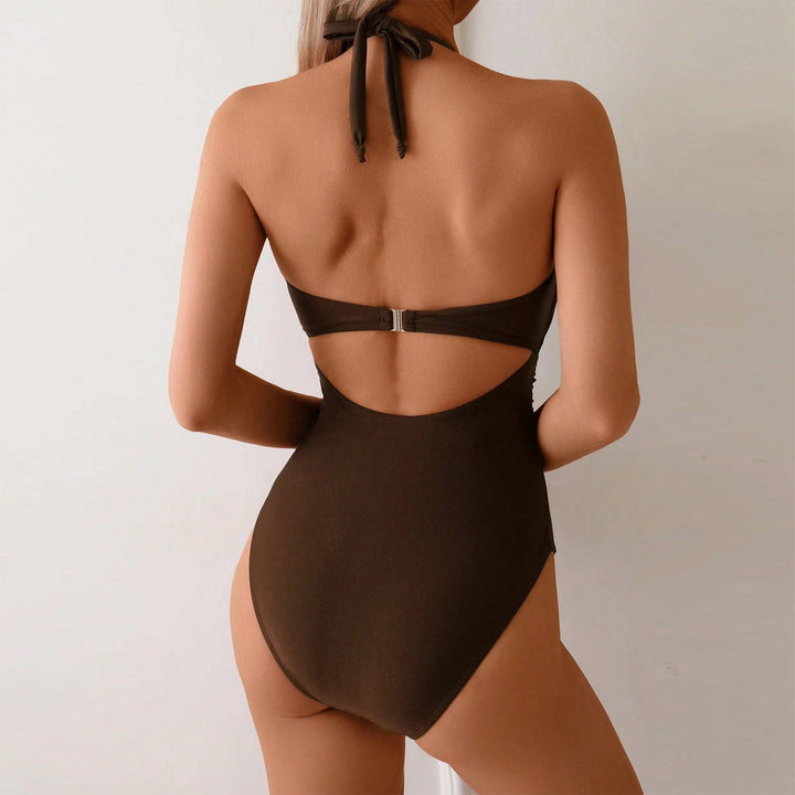 Damer Enstykke badedragt med elegant cut-out og dekorativ musling-applikation Stilla