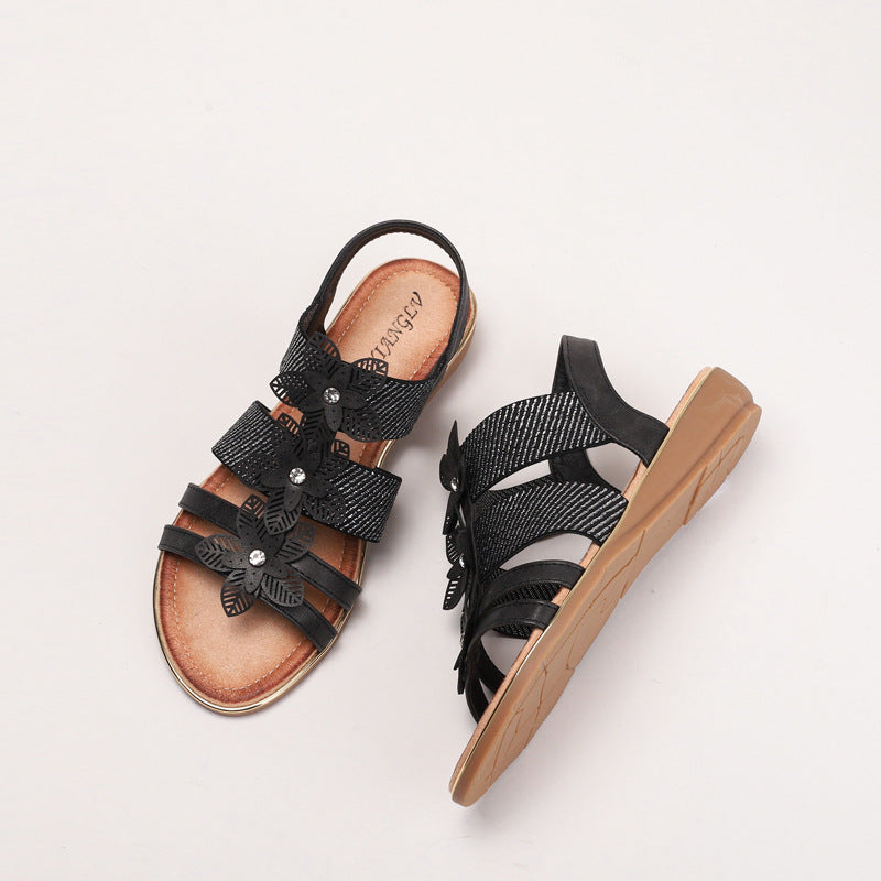 Dame sandaler med blomstret accent og justerbart remdesign Stilla