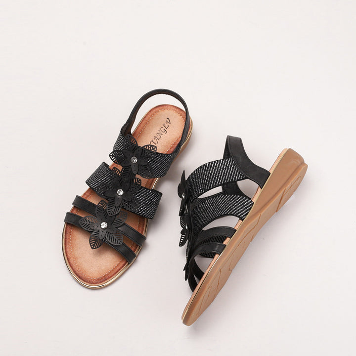 Dame sandaler med blomstret accent og justerbart remdesign Stilla