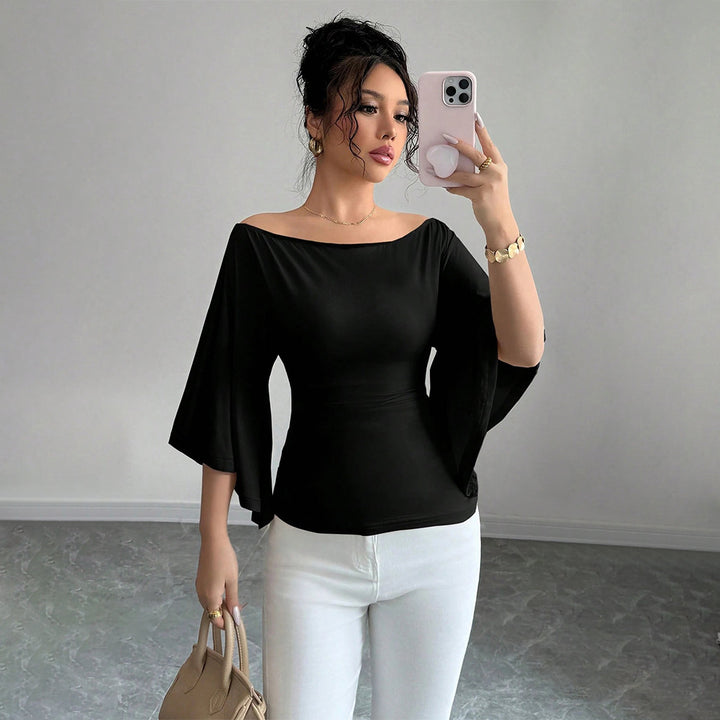 Kvinders elegante off-shoulder top med brede ærmer og tætsiddende pasform Stilla