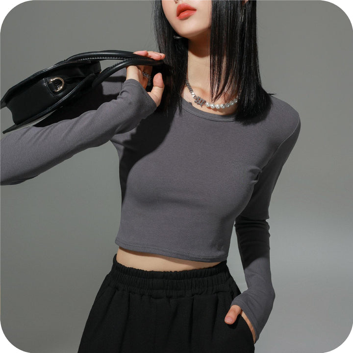 Dame figursyet langærmet crop-top i elastisk materiale med hudvenligt feel Stilla