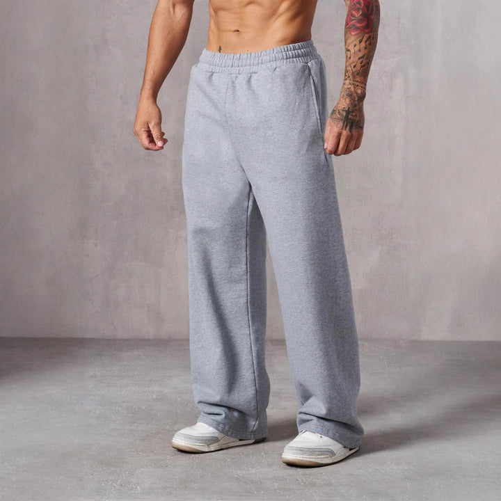 Herre Baggy Joggingbukser med Elastisk Talje og Sidetasker Skovae