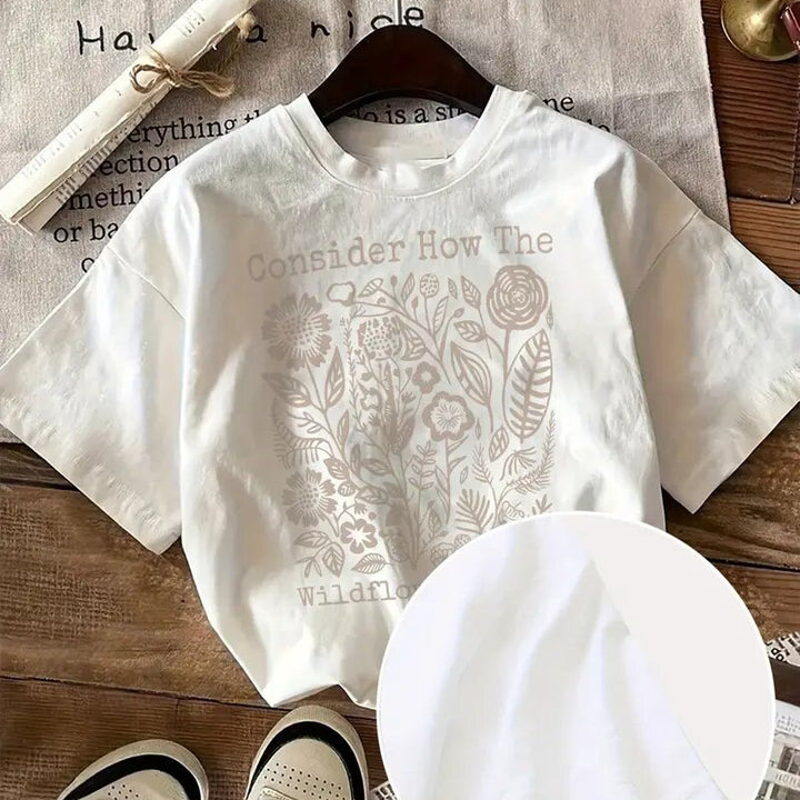 Dame T-shirt med florale motiv og inspirerende skrift Stilla