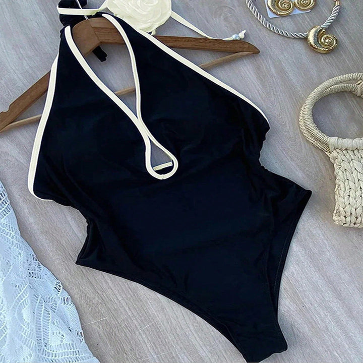 Dame one-piece badedragt med stilfuld blomsteraccent og raffinerede stropdetaljer Skovae