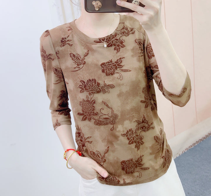 Dame mode blouse med 3/4-ærmer og blomster design Stilla