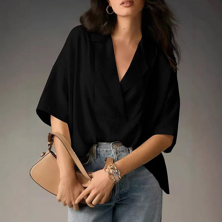 Dame Elegant og komfortabel bluse med V-udskæring og overskudte ærmer Stilla