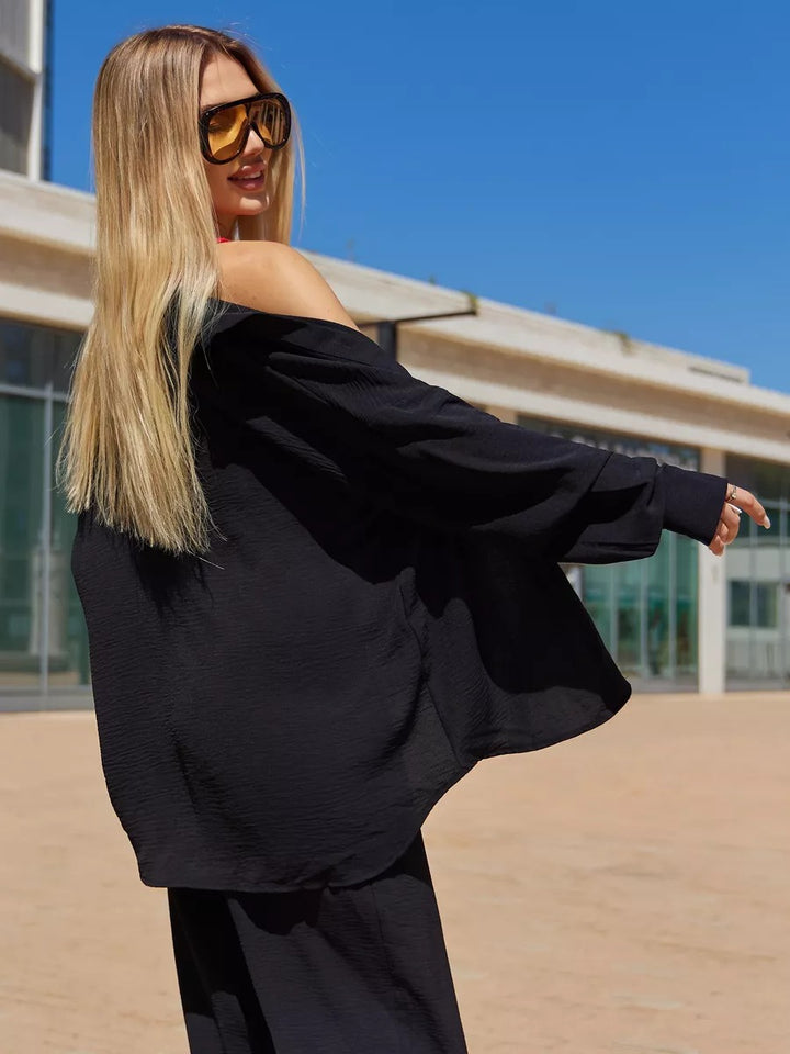 Dame Oversize Bluse med off-shoulder design og flydende snit Stilla
