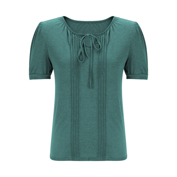 Damebluse med puffærmer og raffineret halterneck Stilla