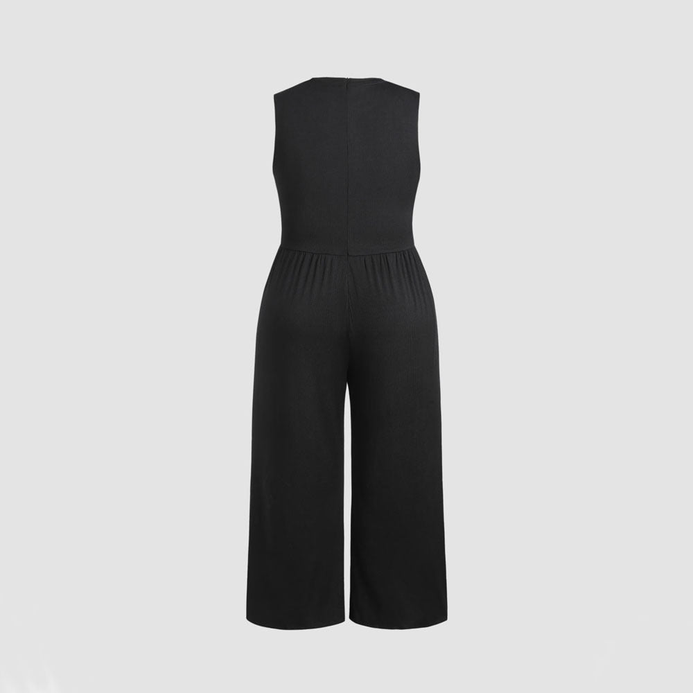 Dame jumpsuit med elegant off-shoulder design og praktiske sidelommer Skovae