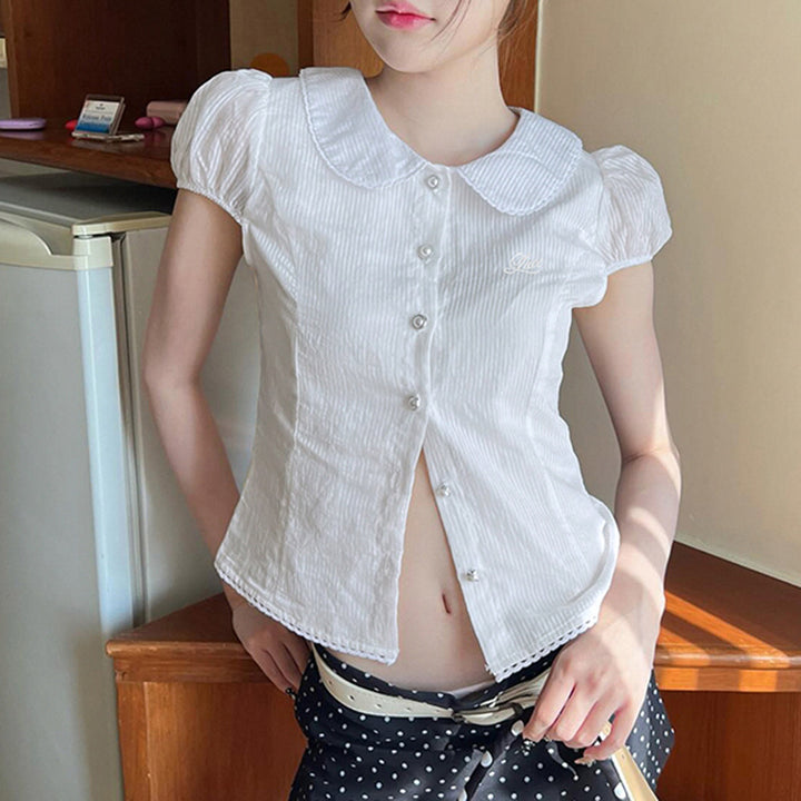 Dame figursyet bluse med elegant krave og knapdetaljer Skovae