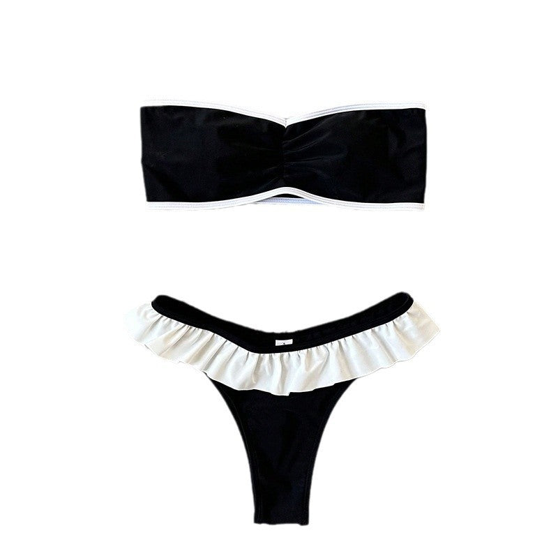 Dame bandeau-bikini med flæsedetaljer og elegant farvekontrast Skovae