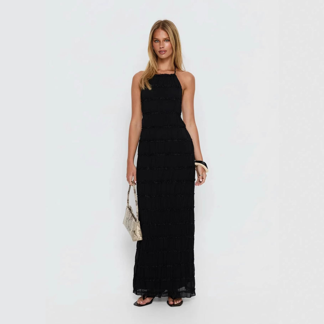 Dame maxikjole med off-the-shoulder design og flydende flæser Skovae