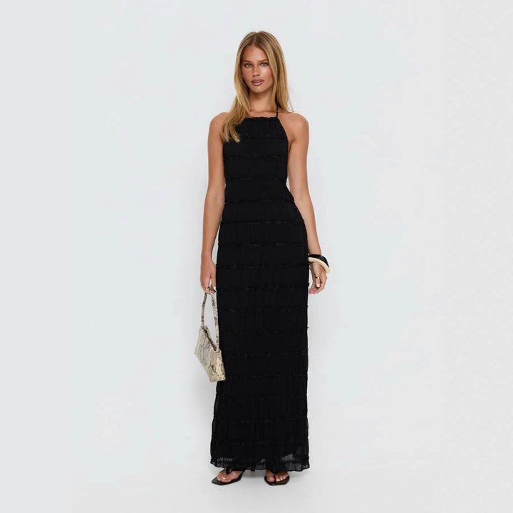 Dame maxikjole med off-the-shoulder design og flydende flæser Skovae