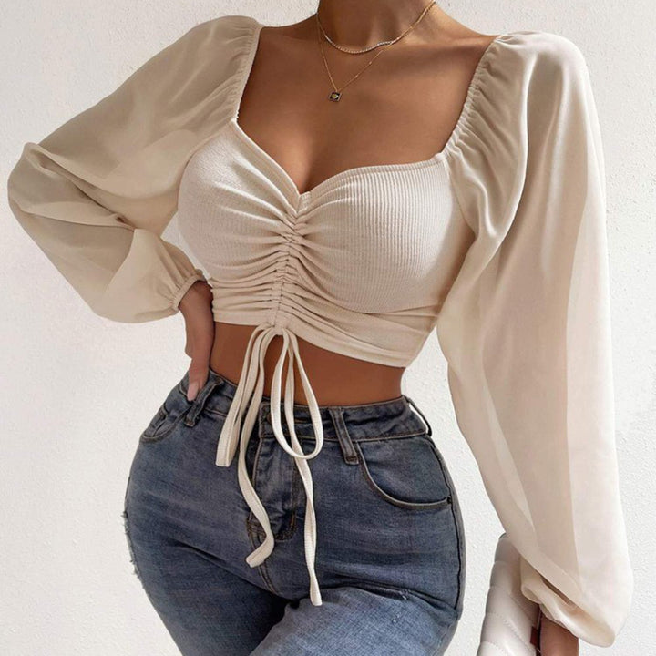 Damebluse med rynket design og ballonformede ærmer Stilla