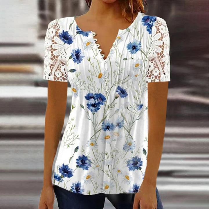 Damebluse med spidse ærmer og blomsterdesign Stilla