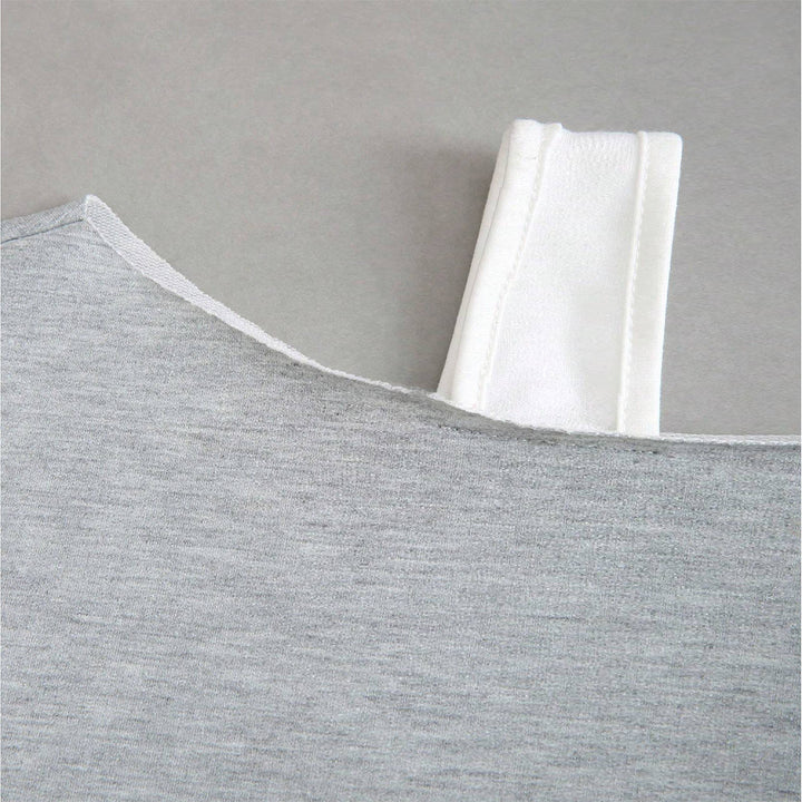 Kvindernes cropped sweatshirt med asymmetrisk design og voluminøse ærmer Stilla