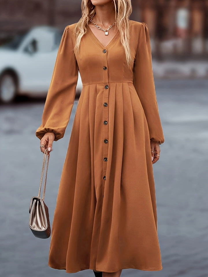 Dame midikjole med knaplukning design og elegante puffærmer Stilla