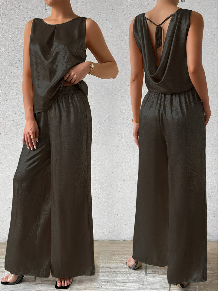 Dame jumpsuit med dyb rygudskæring og flydende silhuet Stilla