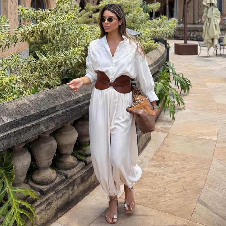 Kvindernes voluminøse jumpsuit med elegant knapbluse og taljebælte Skovae
