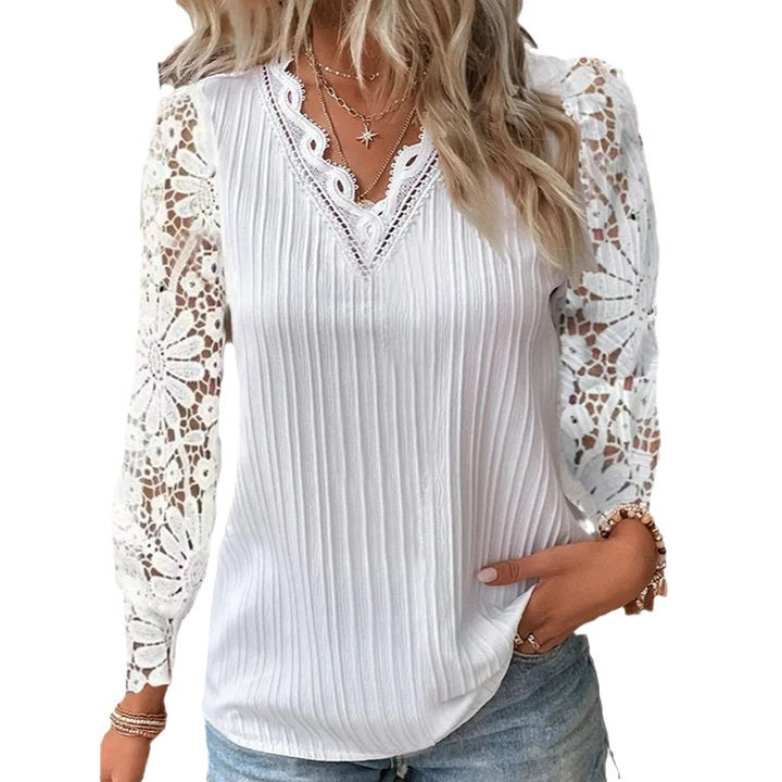 Damebluse med elegante spidse ærmer og længdribstruktur Stilla