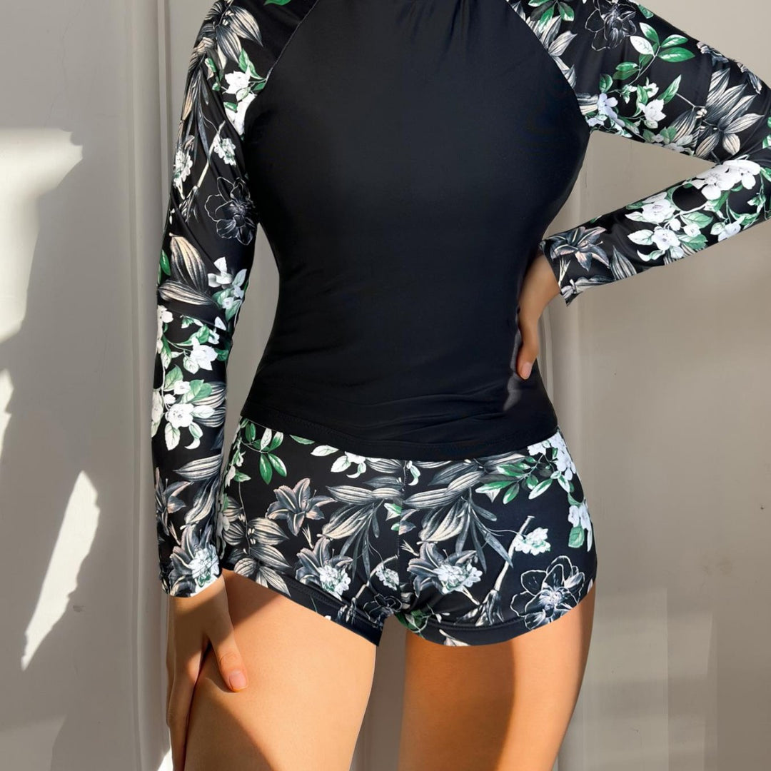 Dame Rashguard-sæt med urban blomstret design og sporty shorts Stilla