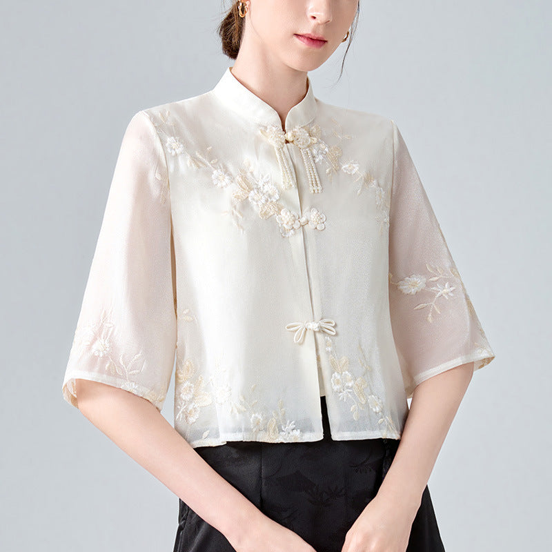 Dame Kortærmet Bluse med kunstnerisk Floralbroderi og elegant Ståkrave Stilla
