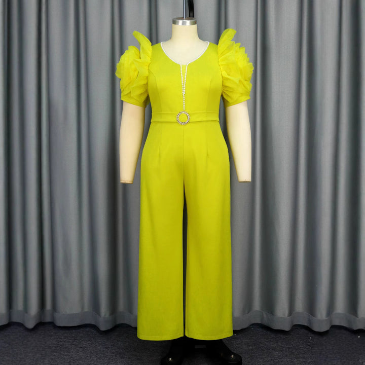 Dame elegant jumpsuit med voluminøse puffærmer og perleaccent Skovae