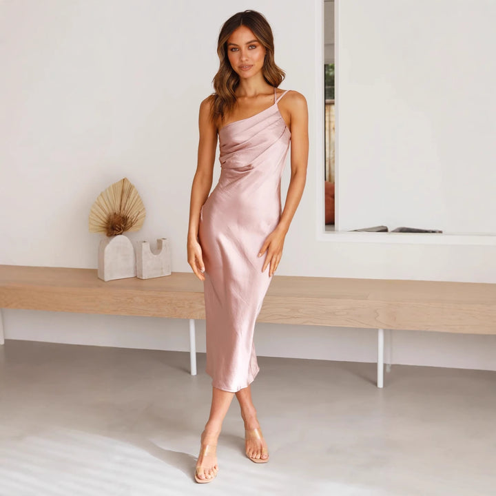 Women's satin midi dress with asymmetrical cut and elegant flair Skovae