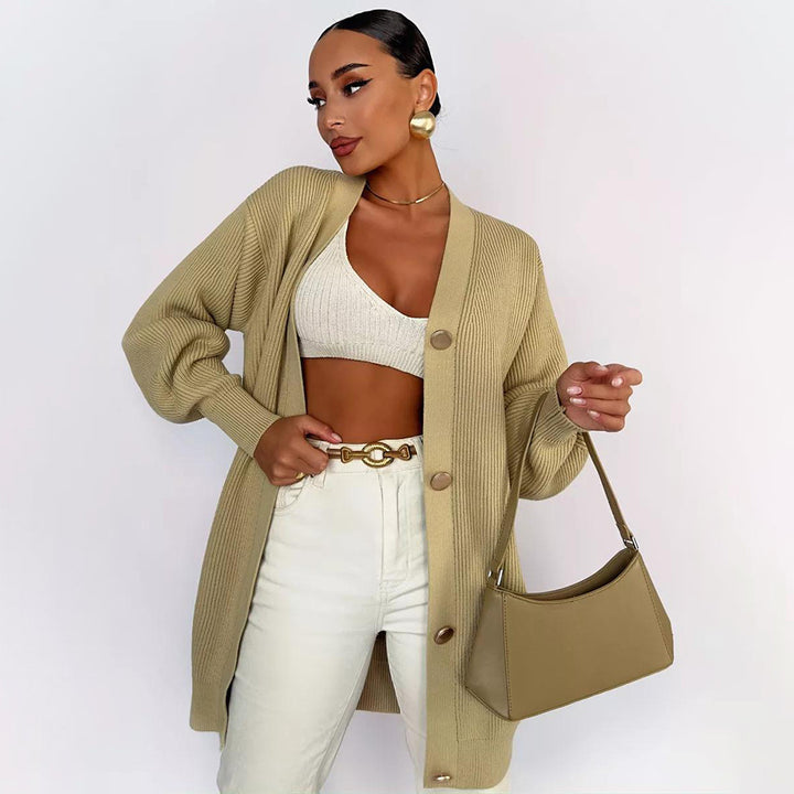 Kvinders strikket frakke med oversized snit og elegante knapdetaljer Stilla