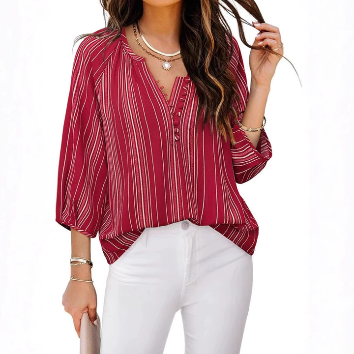 Damebluse med stribet design og elegante knapdetaljer Stilla