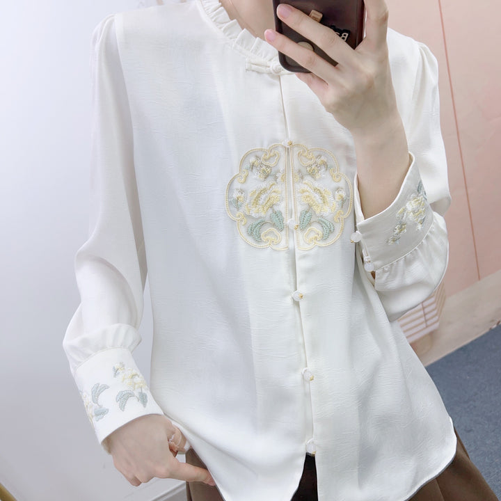 Damebluse med kunstnerisk broderidesign og raffinerede detaljer Stilla
