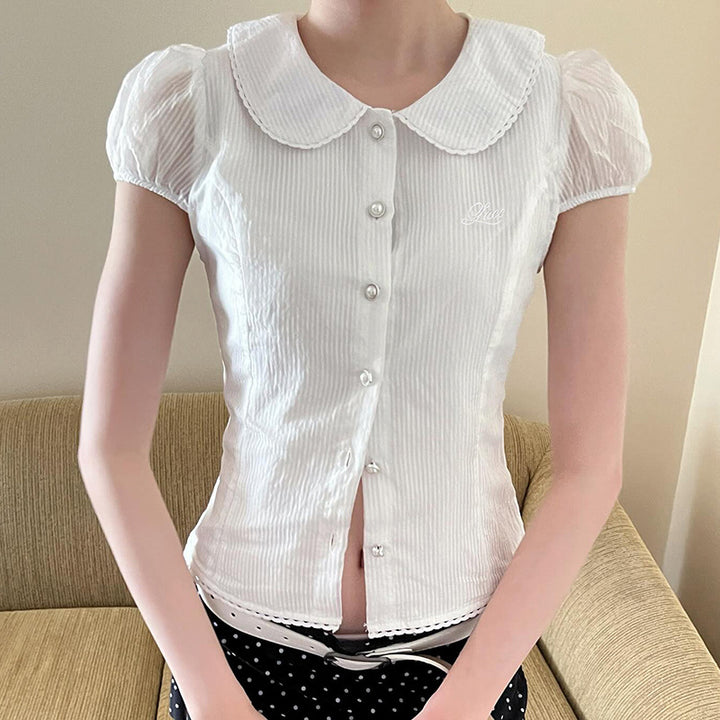 Dame figursyet bluse med elegant krave og knapdetaljer Skovae