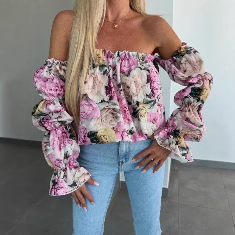 Damebluse med blomstret design og ballonformede ærmer Stilla