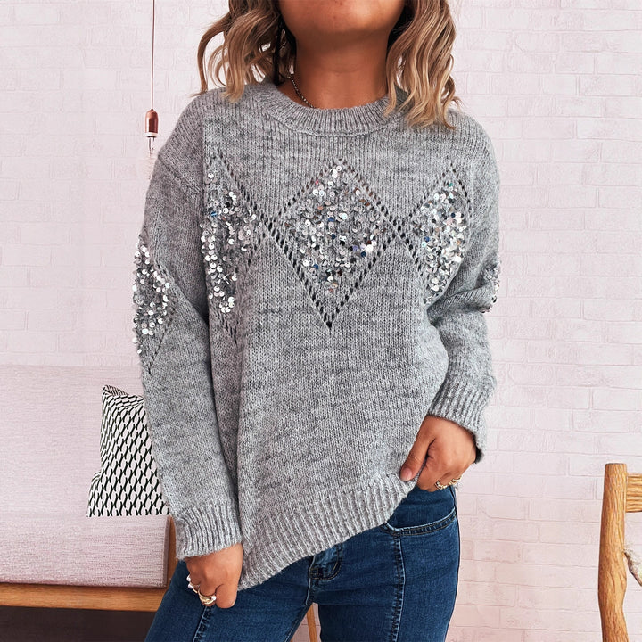 Kvinders elegante strikket sweater med glitrende paletakker Stilla