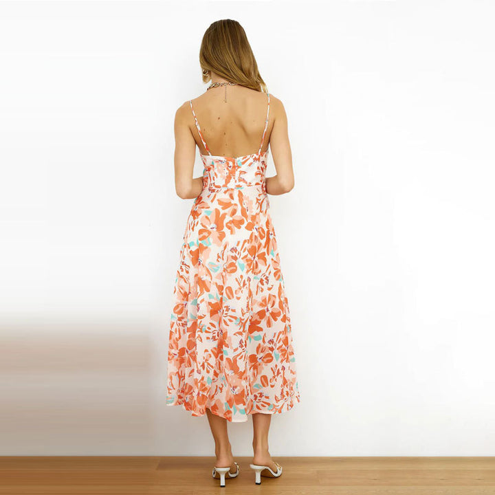 Dame off-shoulder strandkjole med blomsteraccent og svingende kant Stilla