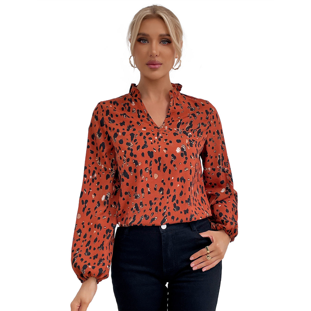 Kvinders bluse med blomsterlig leopardmønster og voluminøse ærmer Stilla