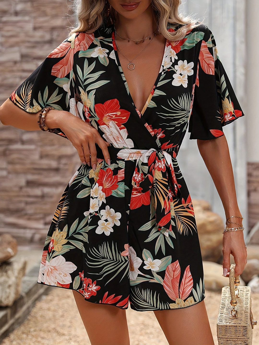 Dame Elegant Wrap Jumpsuit med blomsterdesign og svajende ærmer Stilla