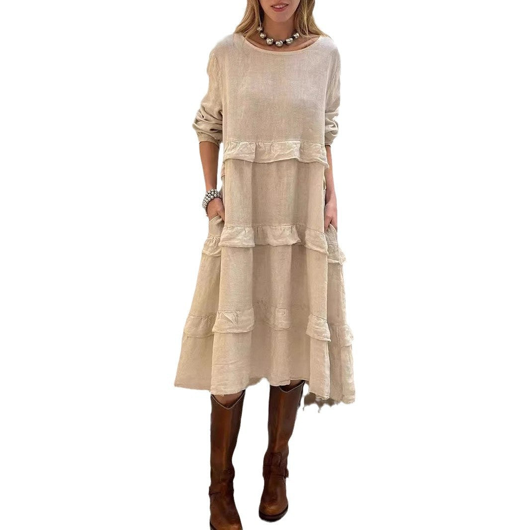 Dame linnedress med voluménøst lagdesign og sidelommer Stilla