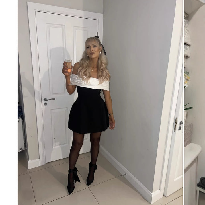 Dame cocktailkjole med off-shoulder design og voluminøs skørt Stilla
