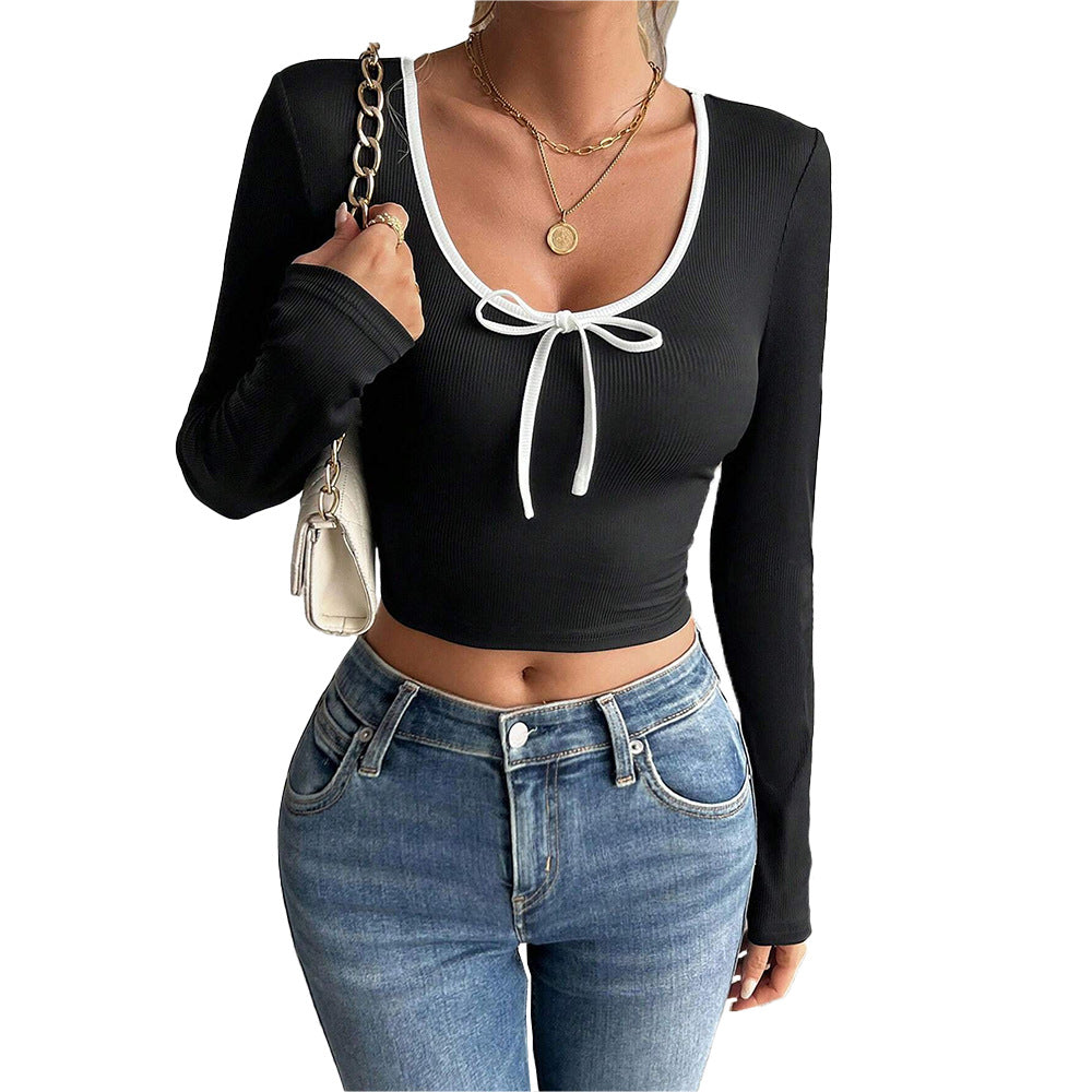 Kvinders langærmet crop top med dekorativ knude og elegant ribstruktur Stilla