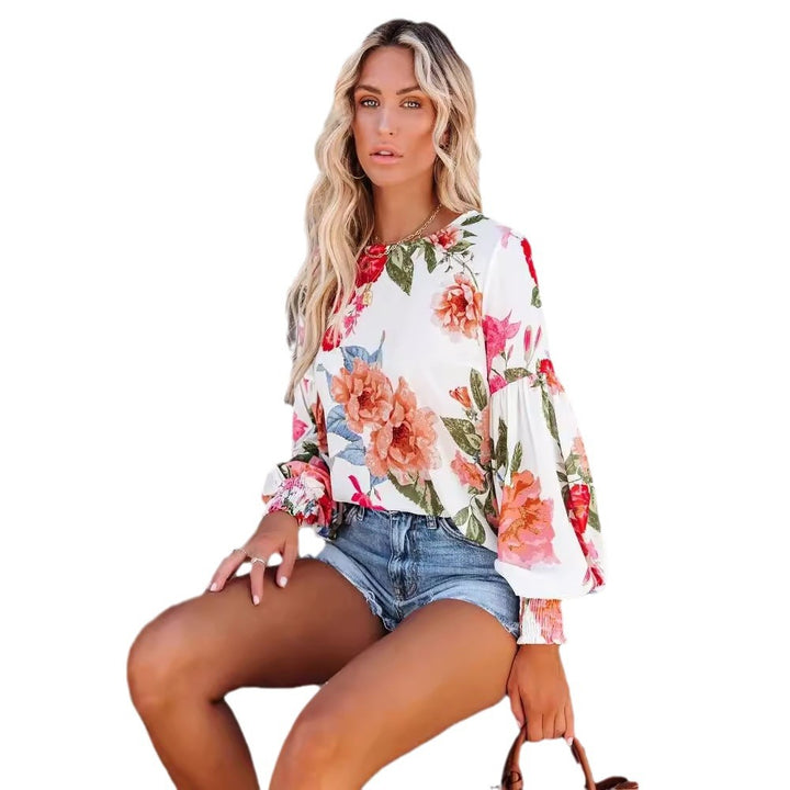Damebluse med voluminøse ærmer og floral mønster Stilla