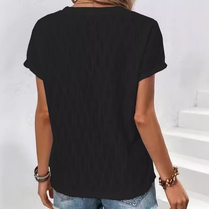 Dame løstsiddende T-shirt med struktureret design og draperet kant Stilla