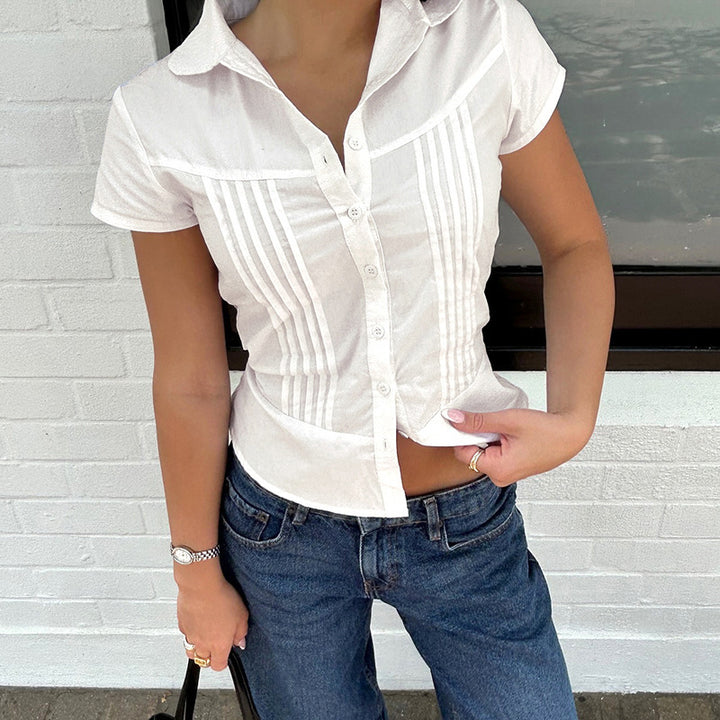 Damebluse med struktureret design og elegant krave Stilla