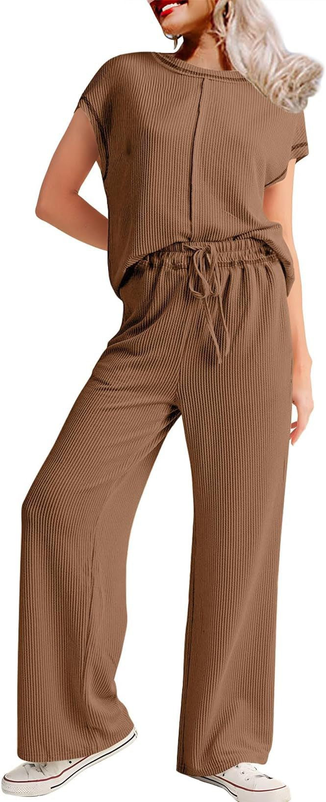 Dame Komfortabel og moderigtigt jumpsuit med brede ben og elastisk talje Stiila