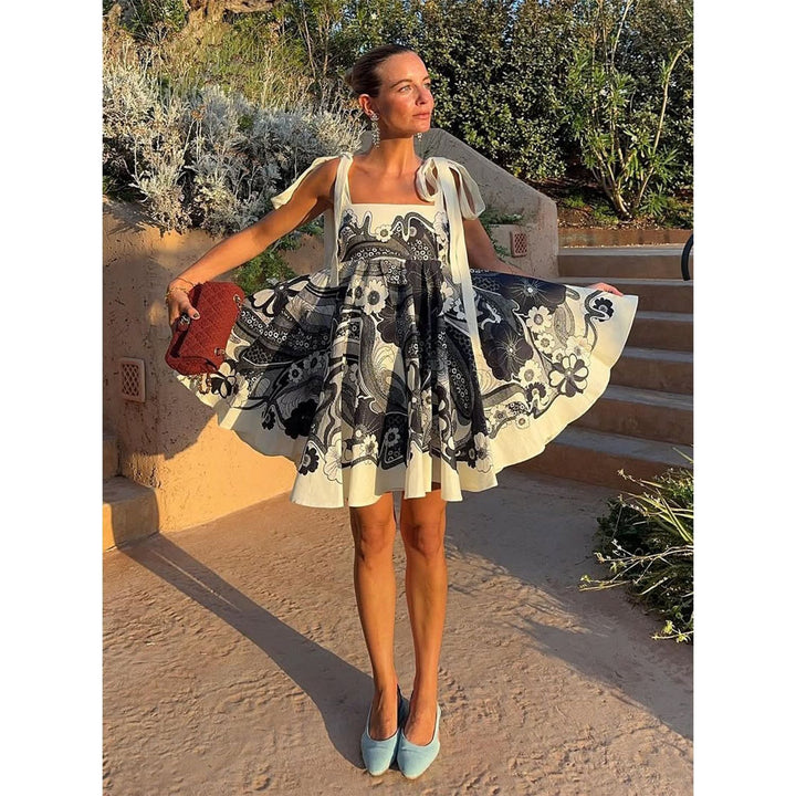 Women's summery mini dress with playful pattern mix and flowy cut Skovae